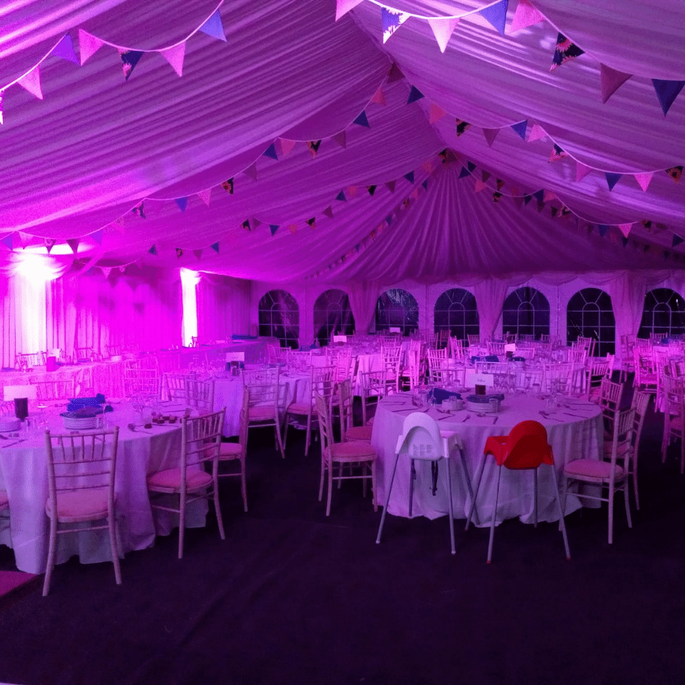 Marquee interior illuminated with pink event lighting