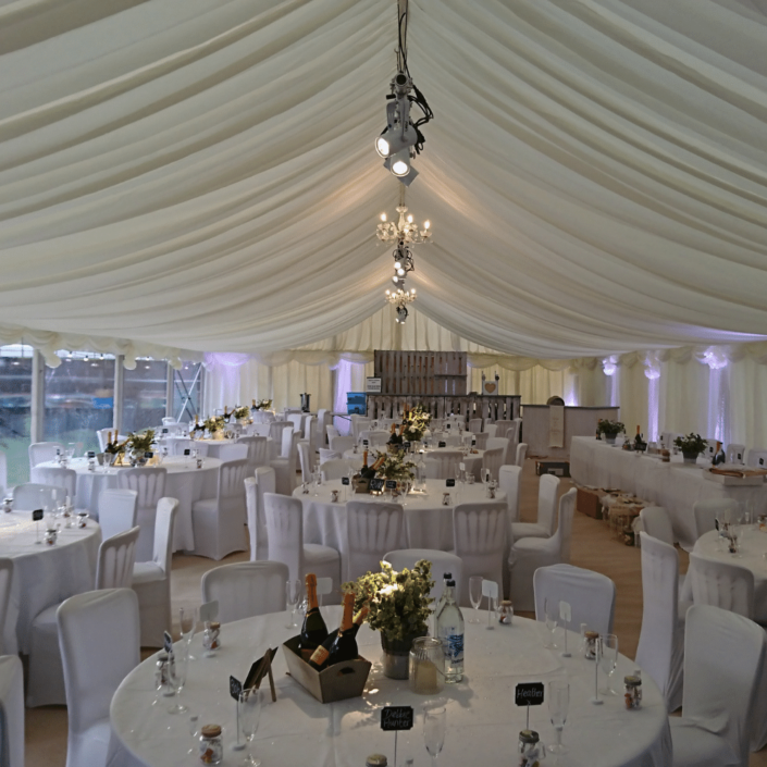 Tables and chairs set for a marquee event