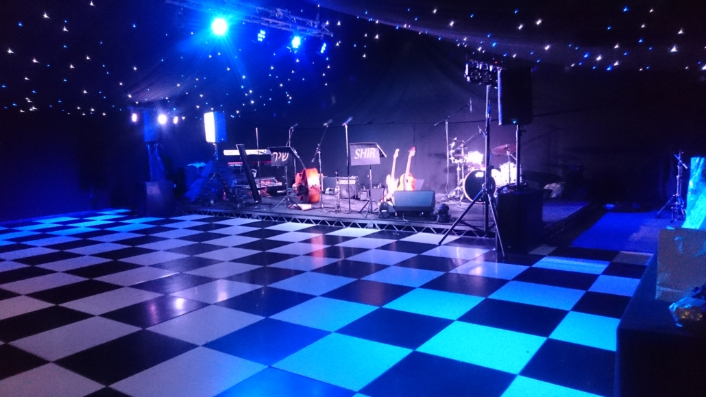 Black and white dancefloor inside a marquee